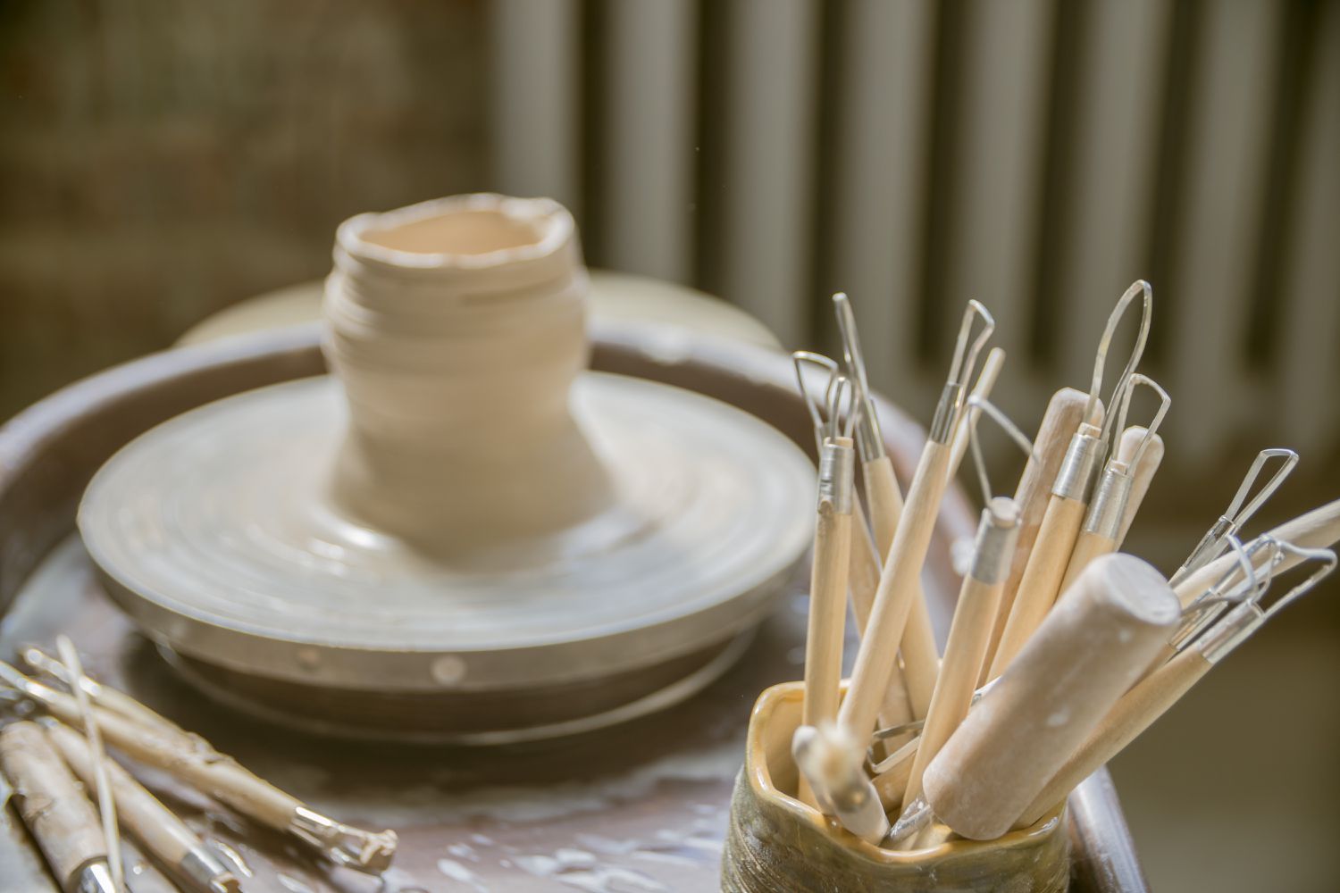 Pottery tools and clay at Happy Hands studio